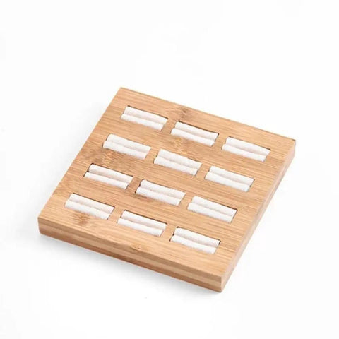 Straight Up The Coolest Wooden Ring Storage Tray With 15 Grids And Soft Velvet Lining To Keep Your Bling Organized On Vanity Or Dresser For Earrings And Bracelets, showing a bamboo tray with white cushioning.