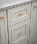 Gathered Blade Cabinet Knob In Brushed Copper Finish, 1-7/16 Inch on kitchen drawers and cabinet doors, installed view