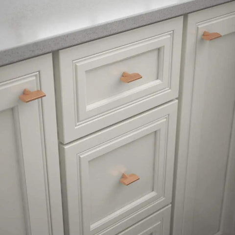 Gathered Blade Cabinet Knob In Brushed Copper Finish, 1-7/16 Inch on kitchen drawers and cabinet doors, installed view