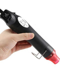 Mini Heat Gun For DIY Projects, Quick Embossing, Shrink Wrap, Paint Drying, 110V Electric Hot Air Tool in hand