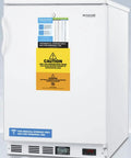 Built Tough Commercial Upright Freezer With Digital Thermostat And Integrated Lock For Tight Secure Storage Solid White Finish with caution labels.