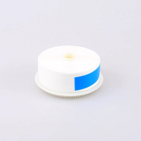 Fiber optic cleaner cloth roll on spool with blue label