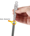 Close-up of a stainless steel taper gauge with metric scale, held in hand, showing 6mm diameter measurement