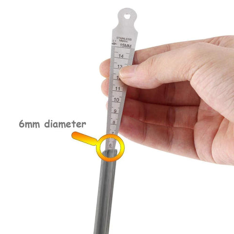 Close-up of a stainless steel taper gauge with metric scale, held in hand, showing 6mm diameter measurement