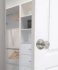 Tulip Style Dummy Doorknob Set, Satin Nickel Finish, 2 Pack, Flush Mount on white closet door, open closet interior view.