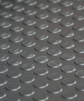 Close-up of dark gray coin pattern rubber flooring, 3.5mm thick, 36 inch by 10 foot sheet, no slip surface for garage and shop.