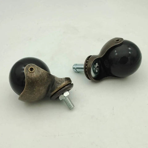Solid Brass Ball Caster Wheels With Tight Locking Brake Four Pack Heavy Duty Polyurethane Rubber Treads black with brass fittings