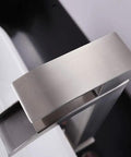 Top view of brushed nickel modern vessel sink faucet in tall waterfall style with a clean minimalist look for contemporary bathrooms.