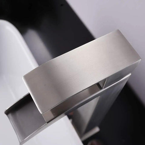 Top view of brushed nickel modern vessel sink faucet in tall waterfall style with a clean minimalist look for contemporary bathrooms.