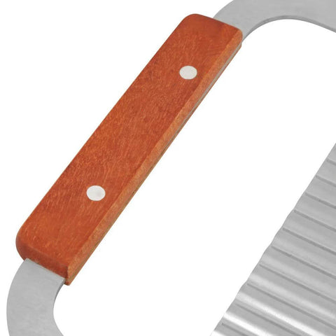 Close-up of wooden-handle crinkle cutter with stainless steel wavy blade, kitchen tool