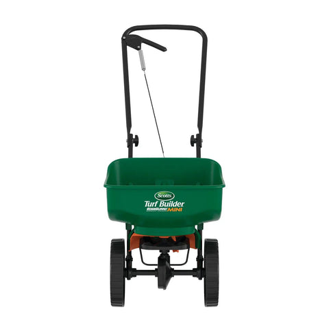 Front view of Turf Builder EdgeGuard Mini Broadcast Spreader For Lawns, holds 5,000 sq ft, pre-calibrated and ready to roll.