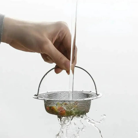 Ditch the Plumbing Headache Forever with This Tough Stainless Steel Sink Strainer Mesh Drain Catcher Filter Screen catching food crumbs.