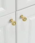 Installed 10 Pack Polished Gold Ball Cabinet Knobs Set 1 Inch Diameter Zinc Alloy Dresser Drawer Handles on white kitchen cabinets.