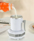 Pouring milk into Portable Electric Mini Fridge Cooler For Desk And Ride Keeps Your Beverages Frosty On The Daily With Rapid Chill Function.