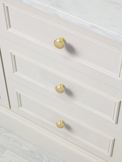 Brushed Gold Cabinet Knobs Round Brass Drawer Pulls Zinc Alloy 2 Pack installed on white kitchen drawer cabinets