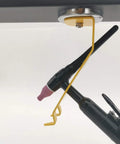 TIG welding torch holder mounted under workbench; 50lb magnetic base, yellow arm, black torch
