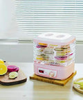 Smooth Operator Electric Food Dehydrator Machine With Five Adjustable Trays And Digital Timer with fruits on trays.