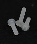 Top Shelf White Nylon Phillips Pan Head Machine Screws M2x8mm Non Conductive Dielectric Fasteners Pack Of One Hundred on a dark background.