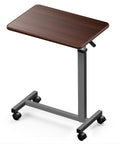 Heavy Duty Pneumatic Overbed Bedside Table With No Sweat Height Adjustment For Home Recovery Or Healthcare Use Non Tilt Surface Durable Walnut Cart, shown at an angle.
