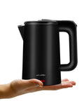 Black Compact 0.8L Electric Kettle Stainless Steel 800W Fast Boil Auto Shut Off Portable Water Boiler held in hand