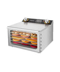 Straight Up Boss Stainless Steel Freeze Dryer With Twelve Sturdy Trays And Smart 12 Hour Timer on a kitchen countertop with fruits.