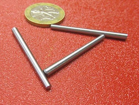 Heavy Duty 18-8 Stainless Steel Taper Pin Set For Precision Machining, shown with a coin for size reference on a red surface