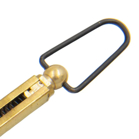 Close-up of Straight Line Muzzleloader Capper for 11 Caps with solid brass construction and spring-loaded cap tube.
