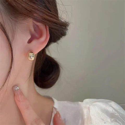 Chunky Half Ball Stud Earrings For Women With Gold Tone Finish Hypoallergenic Minimalist Oval Cartilage Studs Brass Base With 925 Sterling Silver Post Nickel Free And Lead Free Gift Velvet Pouch on ear