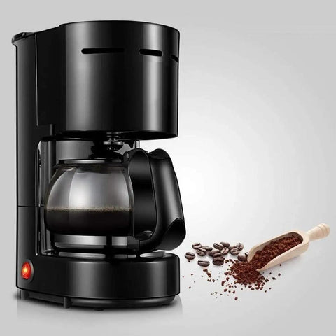 No Sweat Compact Bean To Cup Coffee Machine Featuring Durable Reusable Filter And Smart Backlit Touch Controls Portable Home Espresso Maker with coffee grounds.
