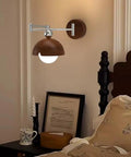 Swing Arm Wall Sconce, Modern Wood Lamp Bedside Reading Bedroom with wooden dome shade and chrome accents.