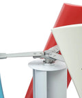 Vertical axis wind turbine blade assembly with blue and red blades attached to a metal hub and bracket