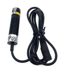 Front view of crosshair alignment module with red cross line light, black ribbed housing and attached cable