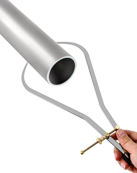Nut Adjustable 12 Inch Spring Dividers Calipers Workhorse For Metalworking And Machining, Beefy Hardened Carbon Steel Tips, Precision Measurement Tool For Accurate Transfer And Layout. 12-inch steel calipers with brass nut adjusting a pipe
