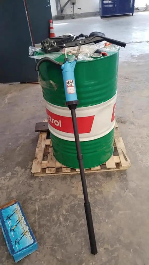 Hand Crank Fuel Transfer Pump For 55 Gallon Drums, Heavy Duty Barrel Pump For Diesel And Oils, Manual Drum Pump With Ergonomic Handle, A Real Workhorse For Water Cleaners And Hydraulic Fluid on green drum