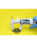 Measuring JANURSDHA 6200 Hybrid Ceramic Bearing Set 10x30x9mm ABEC-1 with calipers, showing 30mm diameter.