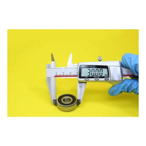 Measuring Heavy Duty 6200 3NC 6200RS 6200HC Hybrid Ceramic Bearings 10x30x9mm with calipers for industrial motor spindles.