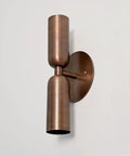 Modern Brass Wall Sconce – Mid Century Cylinder Up and Down Wall Light, Minimalist Indoor Lighting Fixture mounted on a wall.