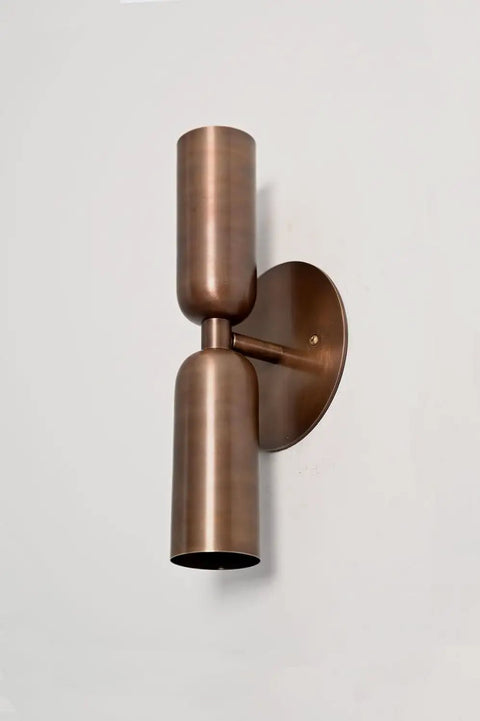 Modern Brass Wall Sconce – Mid Century Cylinder Up and Down Wall Light, Minimalist Indoor Lighting Fixture mounted on a wall.