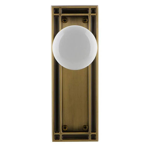 Mission Plate With White Porcelain Knob, Passage Door Hardware In Antique Brass Finish, Retro Classic Style, Front View