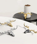 Rock Solid Heavy Duty Wall Hooks For Coats Jackets And Kitchen Towels Premium Zinc Mounting Hardware Quick Install Clothes Rack stylish antler design in gold and silver.
