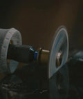 Dremel EZ Lock cutting disc mounted on a rotary tool, side view.