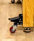Heavy Duty Steel Caster Set For Router Tables, Workbenches, Cabinets And Tool Stands With 800 LB Capacity installed on wood surface