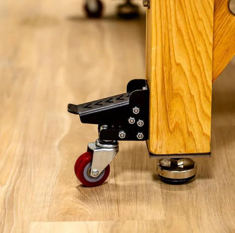 Heavy Duty Steel Caster Set For Router Tables, Workbenches, Cabinets And Tool Stands With 800 LB Capacity installed on wood surface