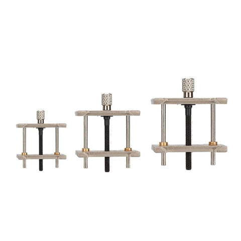 Three-piece Metal Watch Movement Holder Set with reversible watch repair tools, showing different sizes for 1.8, 1.5, and 1 inch movements.