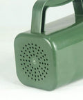 Side view of green all purpose garden soil scoop for digging and moving soil with ergonomic grip hand shovel.