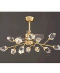 Slick Full Bronze Ceiling Fan With Integrated Lighting And Six Speed Settings Pumps Out Killer Airflow Alongside Whisper Quiet Operation Plus Super Responsive Remote Control Perfect For Living Room Bedroom Or Family Space. Ceiling fan with gold finish and decorative crystal accents.