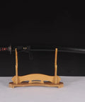 Handmade Practice Katana For Iaido Training Full Tang Sharp Blade Japanese Samurai Sword displayed on a wooden stand