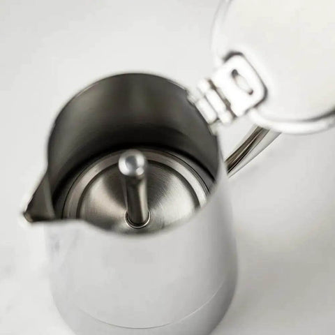Open top view of a Stainless Steel Stovetop Espresso Maker for 6 cups, showing heat-resistant, non-reactive design for rich bold brew