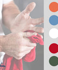Person holding a red towel with color samples; Blue 14x14 Inch 100-Pack Cotton Auto Shop Towels For Detailing And Industrial Cleaning