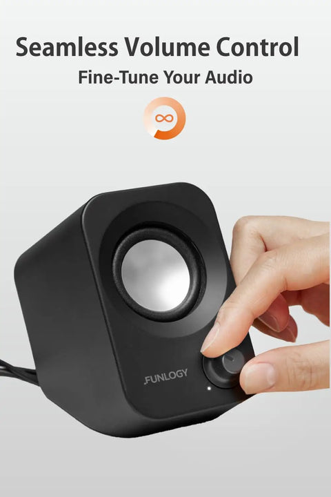 Hand adjusting volume dial on 14W USB Powered Stereo PC Speakers With Compact Size And 30 Degree Tilt Design Volume Dial Control